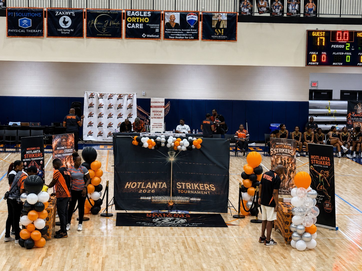 HotLanta Strikers 2024 tournament setup with black and gold balloon decorations on an indoor court